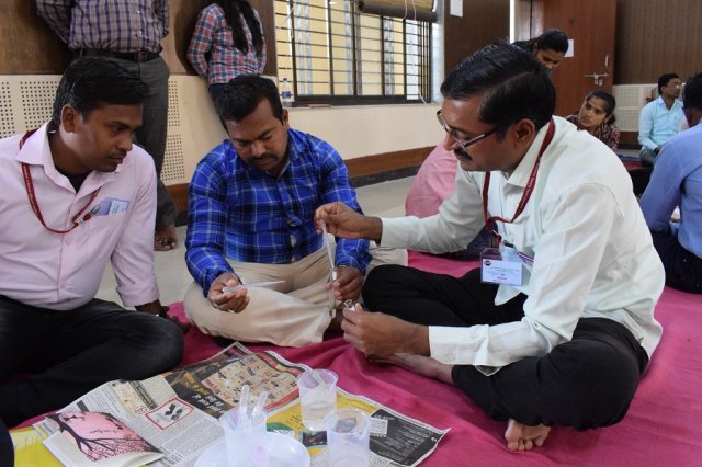Teachers doing the practical of titration.